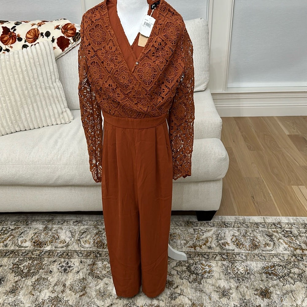 Brand new jumpsuit with lace top and wide leg bottom